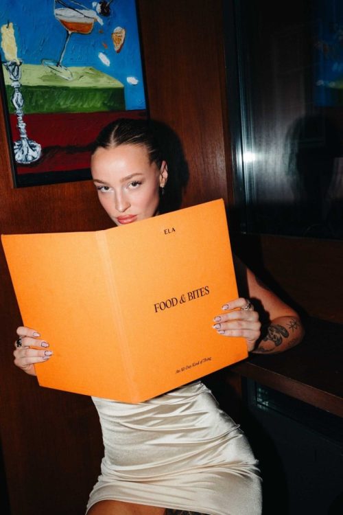 ela-restobar-food-girl-holding-food-and-bites-menu