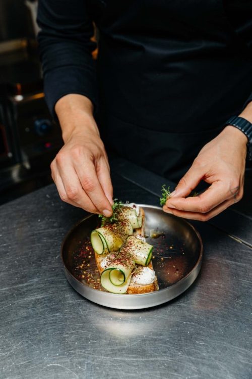 ela-restobar-kitchen-preparing-sourdough-sandwich-with-labneh-and-zucchini